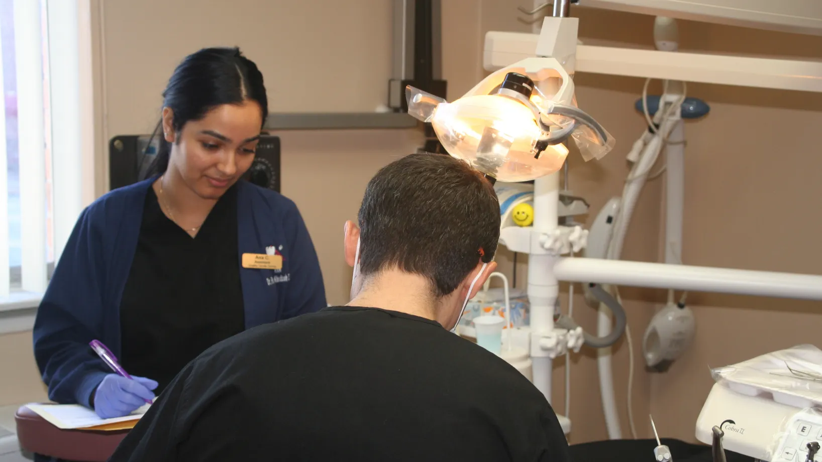 a dentist talking to a patient in a dental office