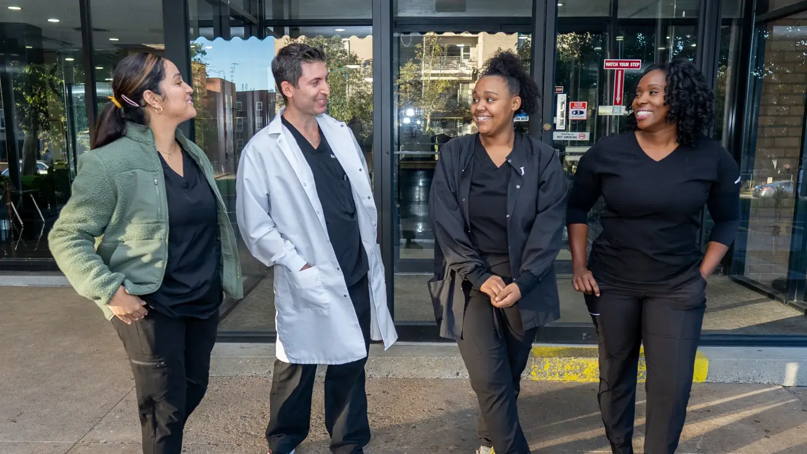 a group of people standing in front of a building