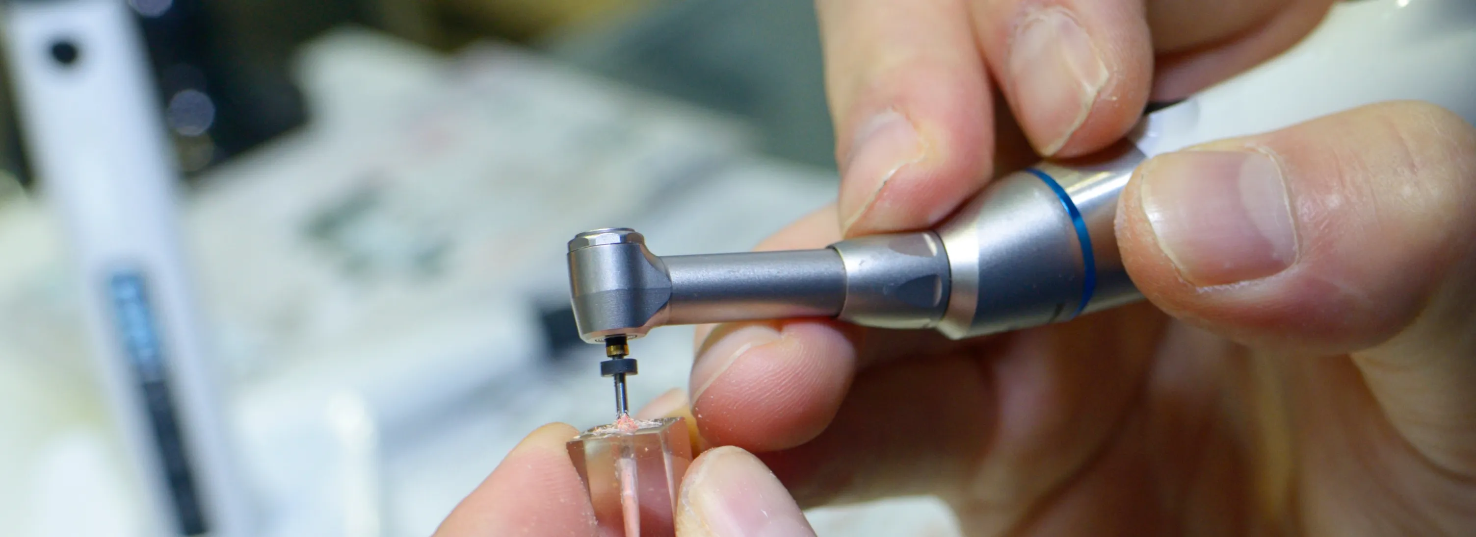 a close up of a person holding a small device